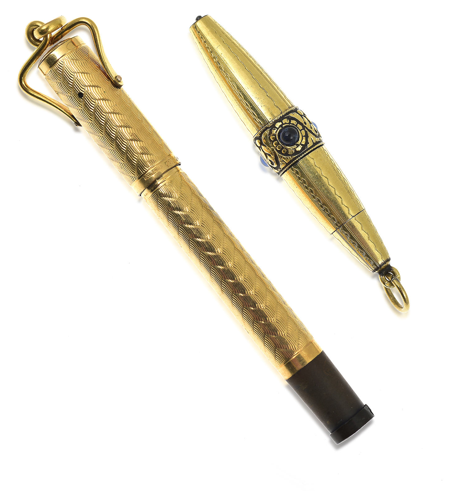 Appraisal: A VINTAGE PEN AND PROPELLING PENCIL One set with sapphires