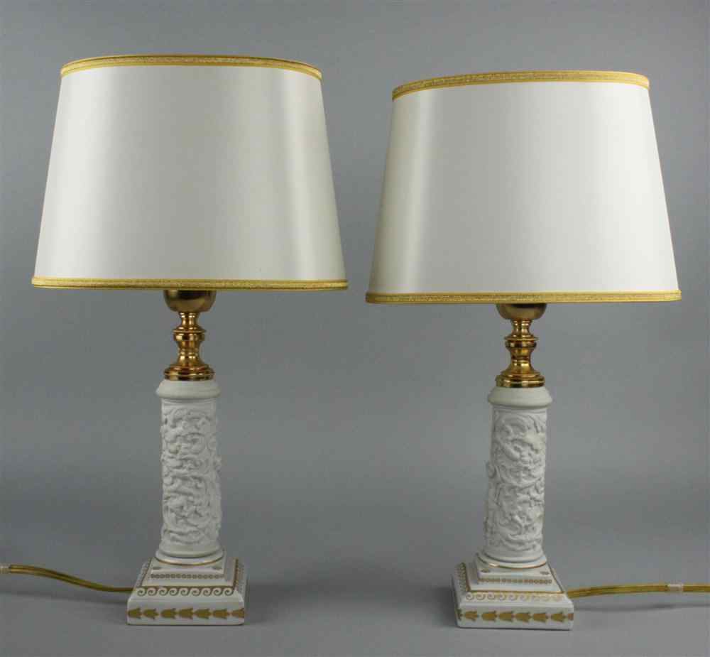 Appraisal: PAIR OF BISCUIT TABLE LAMPS columnar molded with putti standing