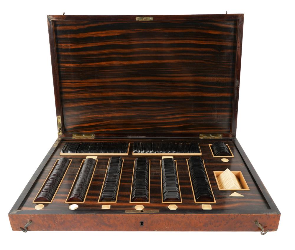 Appraisal: POKER CHIP SETfitted burl wood case Condition veneer loss and