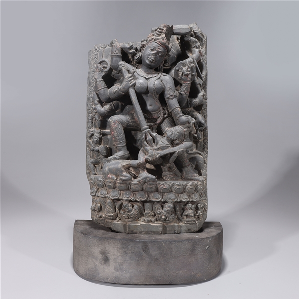 Appraisal: Elaborately carved antique Indian carved stone multi-armed deity with attendant