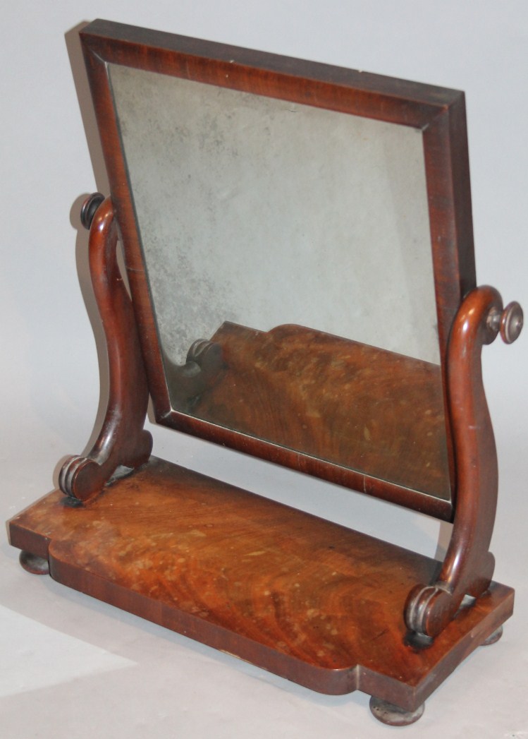 Appraisal: A Victorian mahogany table mirror the rectangular glass flanked by