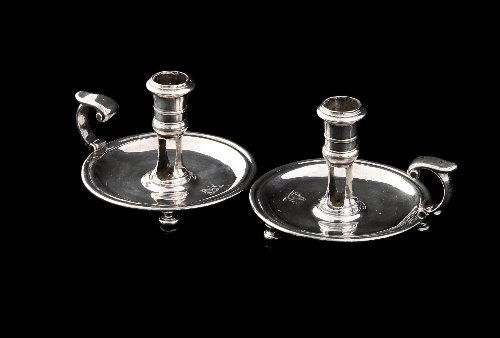 Appraisal: A pair of George I silver circular chambersticks Daniel Yerbury