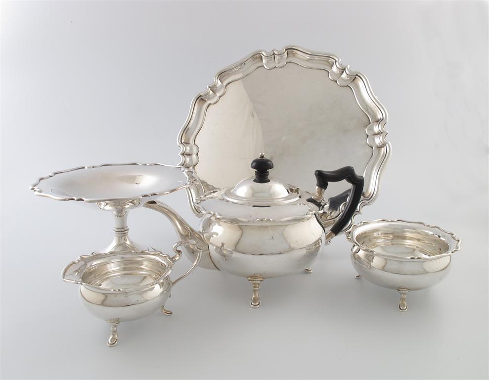 Appraisal: A three-piece silver tea set and matching electroplated tazza