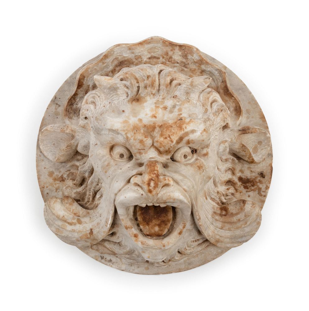 Appraisal: A Continental Carved Stone Grotesque Mask A Continental Carved Stone