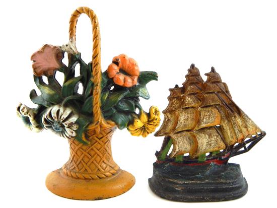 Appraisal: Two painted cast-iron doorstops leafy flowers in ochre-colored latticework basket