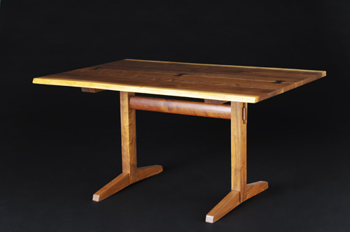 Appraisal: GEORGE NAKASHIMA Walnut Turned-Leg table with boat-shaped top incorporating four