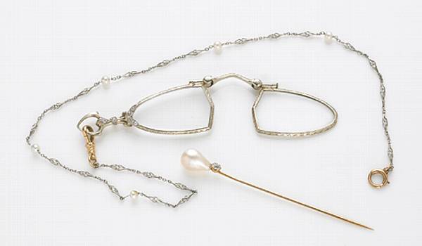 Appraisal: A diamond and k gold lorgnette with platinum and cultured