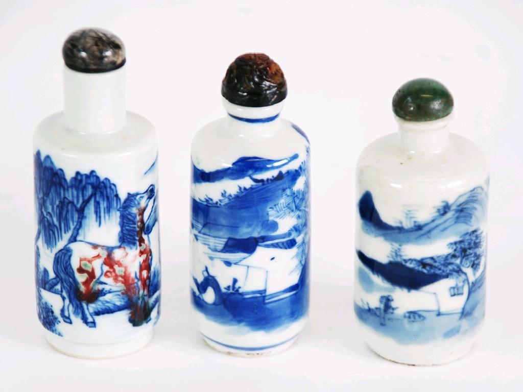 Appraisal: THREE CHINESE PORCELAIN ROULEAU FORM SNUFF BOTTLES with associated stoppers