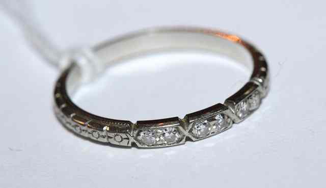 Appraisal: A DIAMOND SET HALF ETERNITY RING set with six diamonds