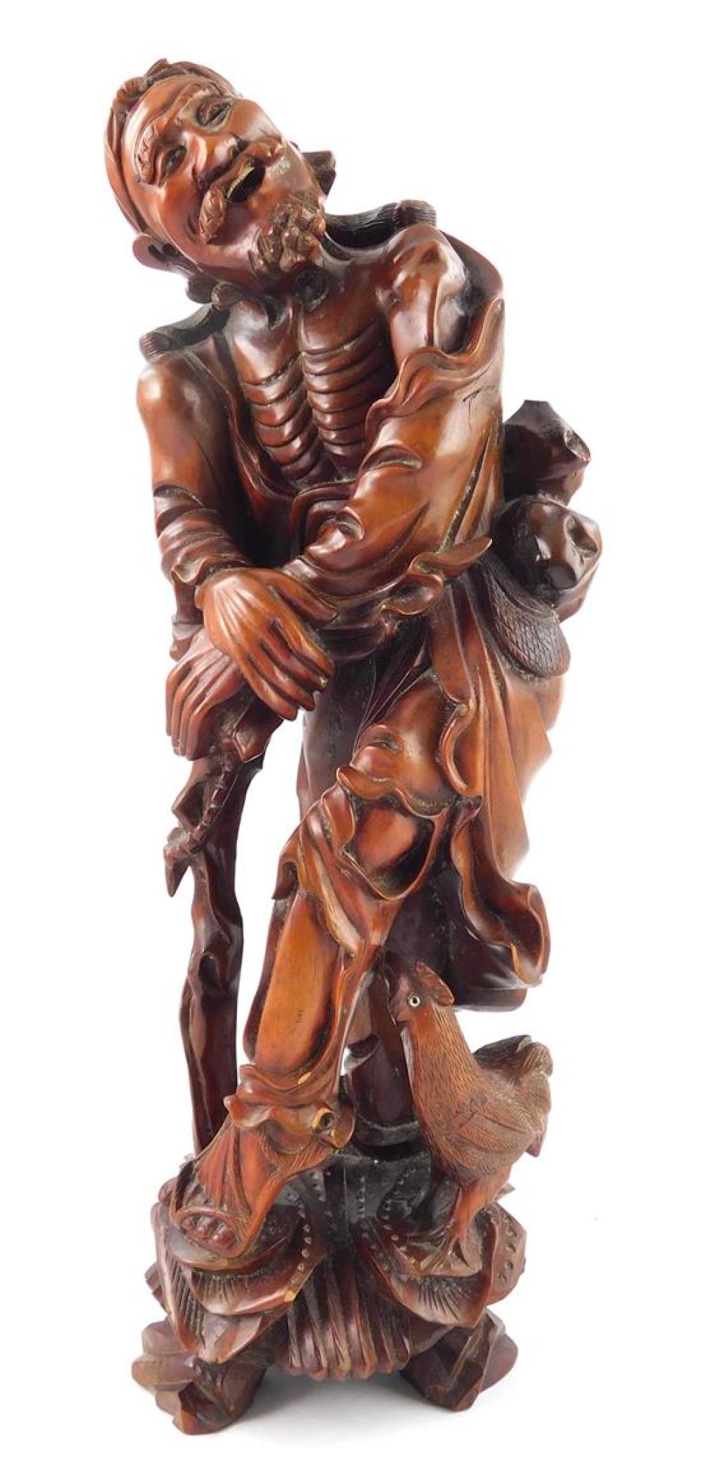 Appraisal: Carved wood figure of an Immortal probably Li Tieguai Asian