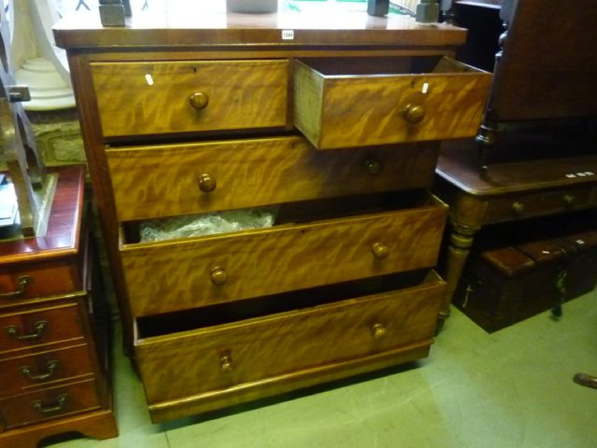 Appraisal: A Victorian satin birch bedroom chest of three long and