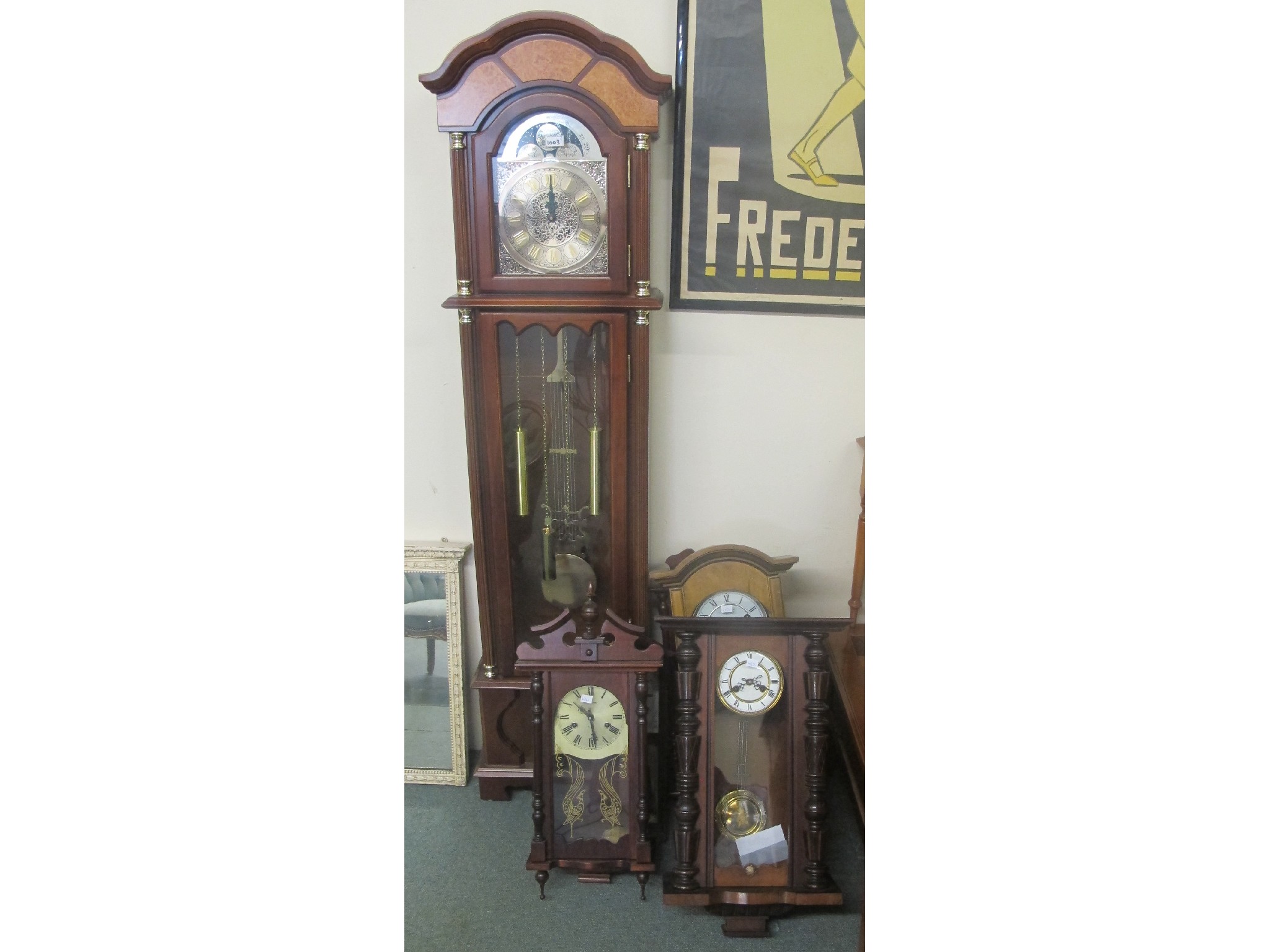 Appraisal: A reproduction longcase clock and four other modern wall clocks