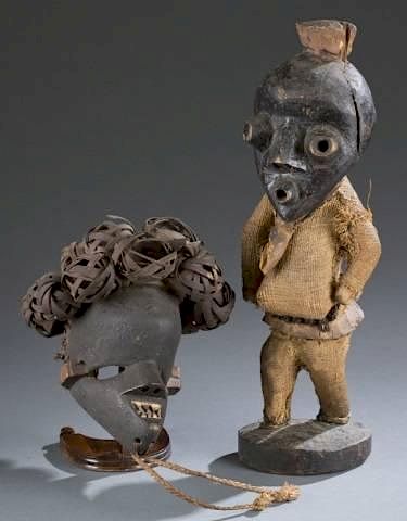 Appraisal: African tribal mask standing figure A n African tribal mask