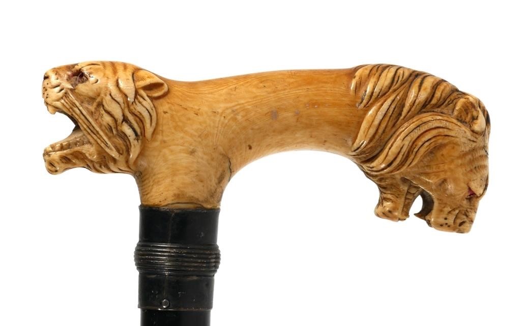 Appraisal: Antique s walking stick Circus animal themed highly detailed carving