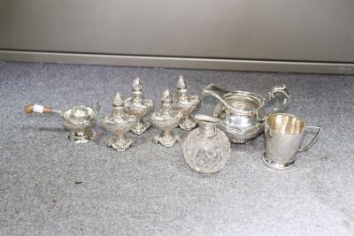 Appraisal: Four silver pepper pots Birmingham import marks embossed shepherdess and