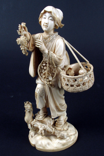 Appraisal: MEIJI PERIOD JAPANESE IVORY CARVED FIGURE depicting woman vendor hawking