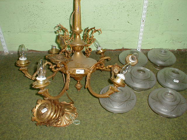 Appraisal: A gilt metal six light electrolier with etched glass shades