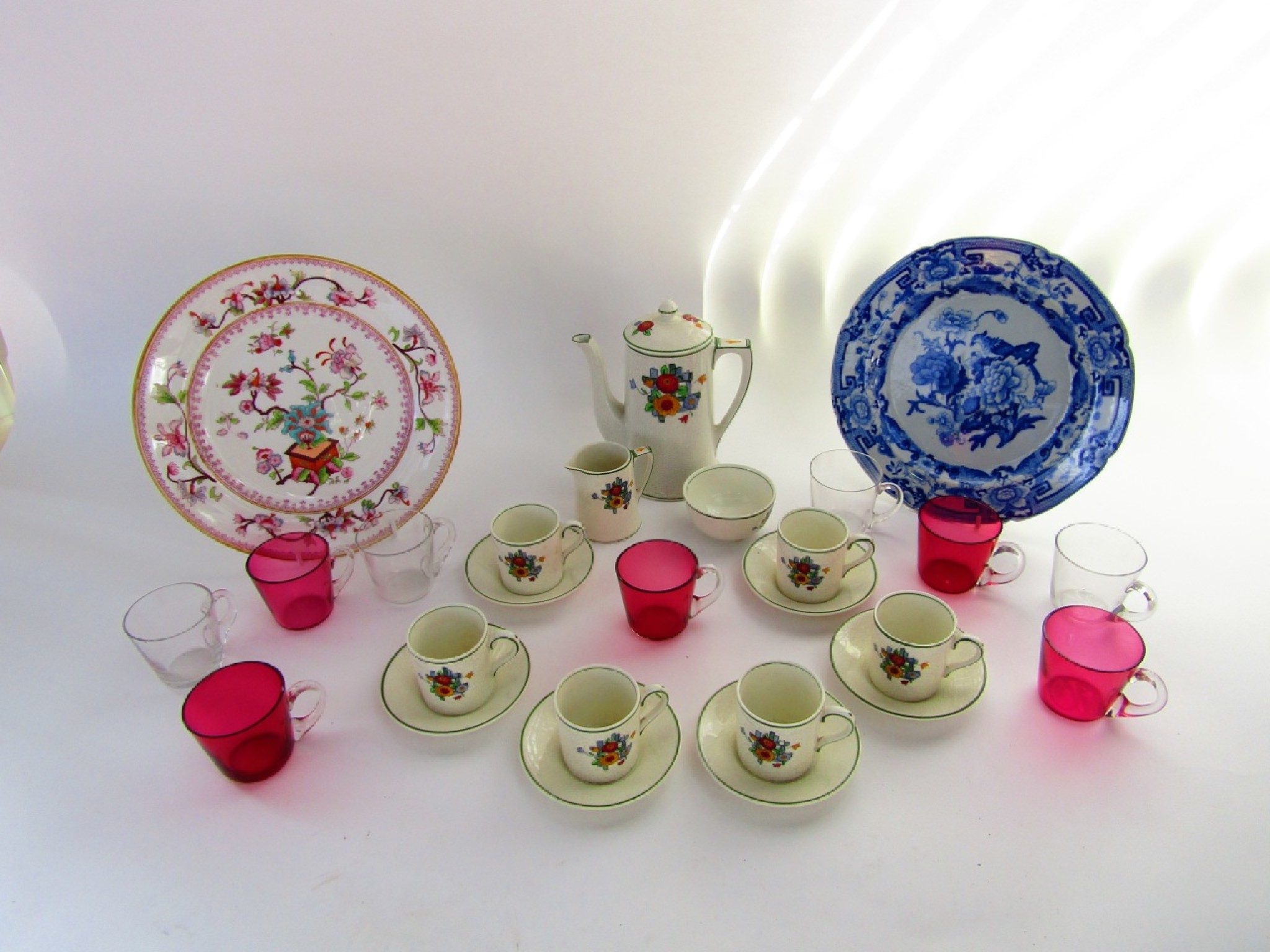 Appraisal: A collection of five cranberry and four clear glass custard