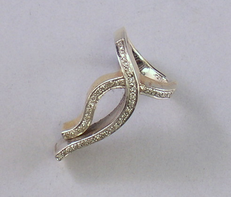 Appraisal: Bicolor kt Gold and Diamond Wave-form Ring total dwt size