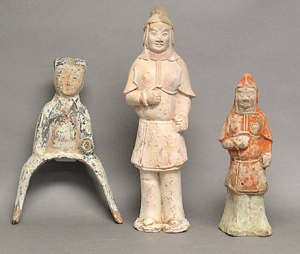 Appraisal: Three painted pottery tomb figures The first a Han Dynasty