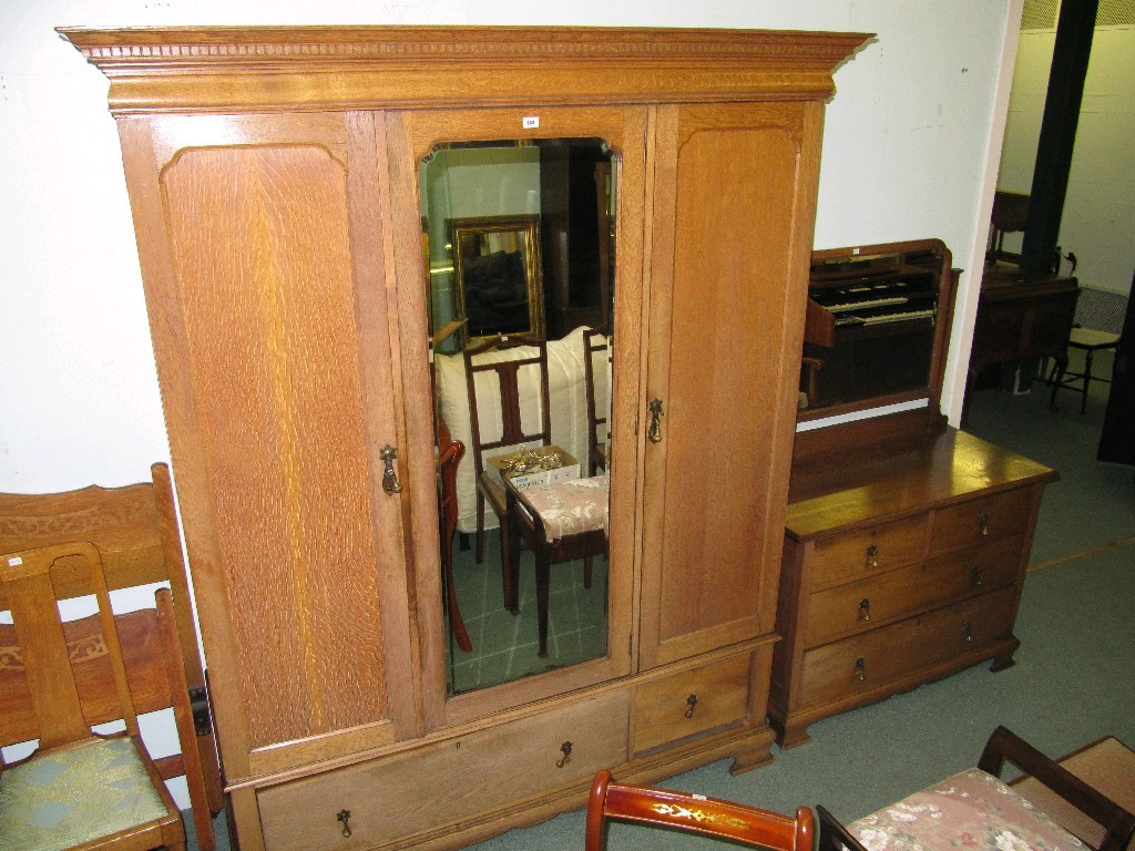 Appraisal: Oak bedroom suite comprising three section mirror door wardrobe dressing