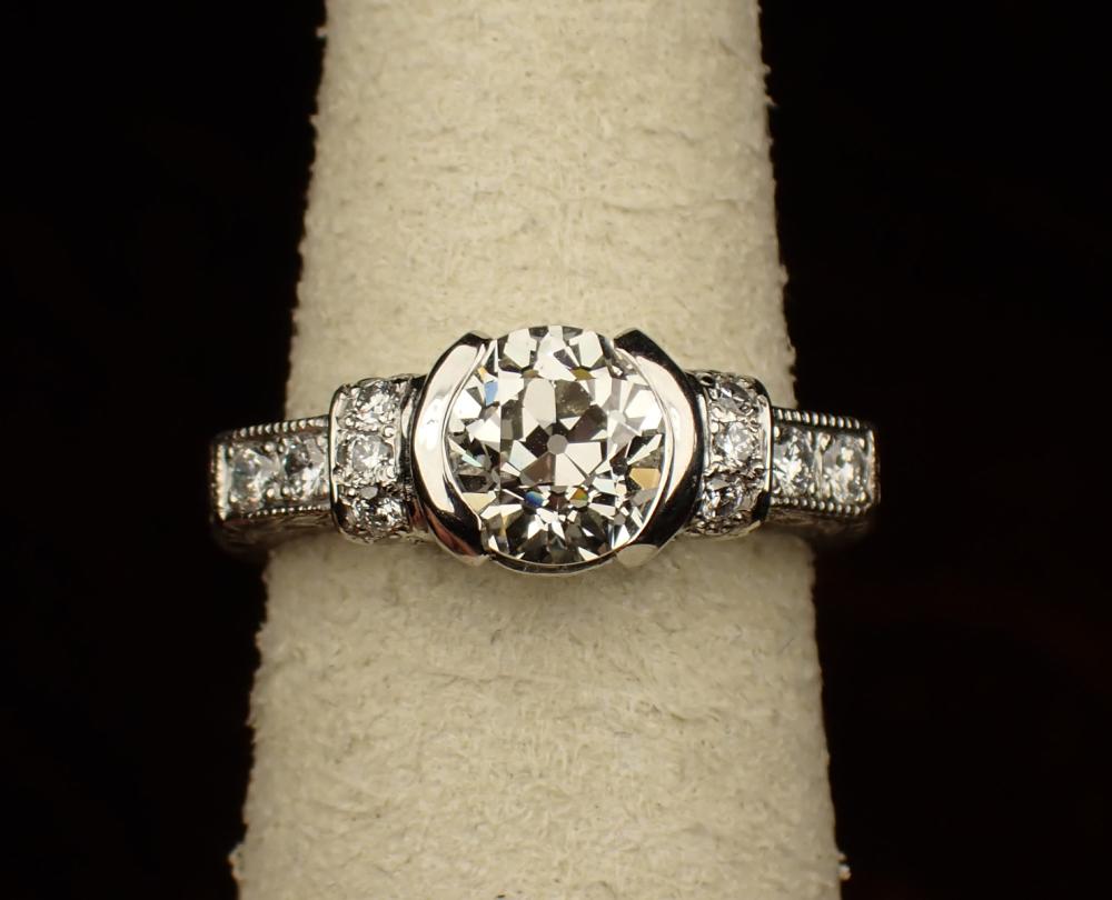 Appraisal: ESTATE DIAMOND AND FILIGREE ENGRAVED PLATINUM RING The vintage style