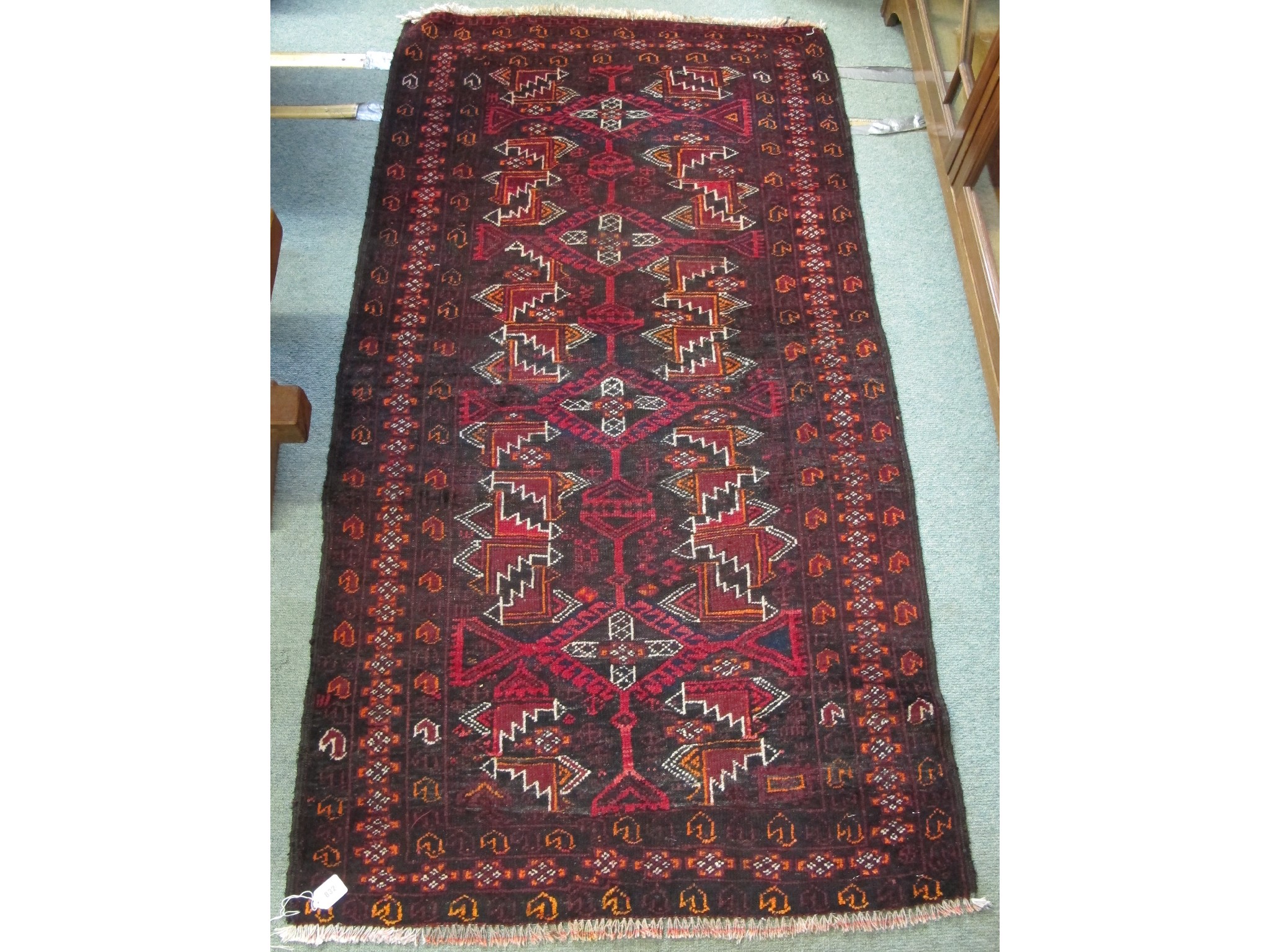 Appraisal: A dark Baluchi rug x cm