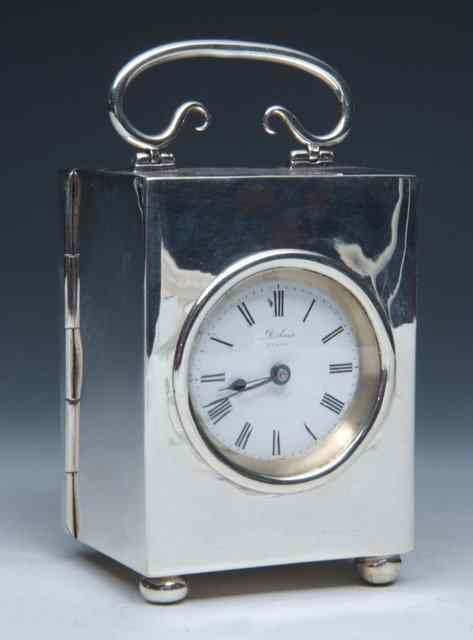 Appraisal: A SILVER MOUNTED CARRIAGE CLOCK with enamel dial the case