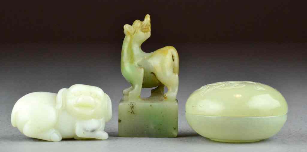 Appraisal: Chinese Carved JadesTo include a white jade toggle formed as