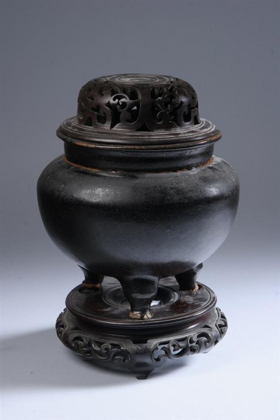 Appraisal: CHINESE BLACK GLAZED PORCELAIN TRIPOD CENSER Qing Dynasty - in