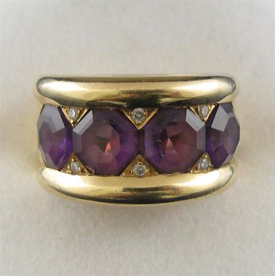 Appraisal: An amethyst and diamond ring set with four octagonal cut