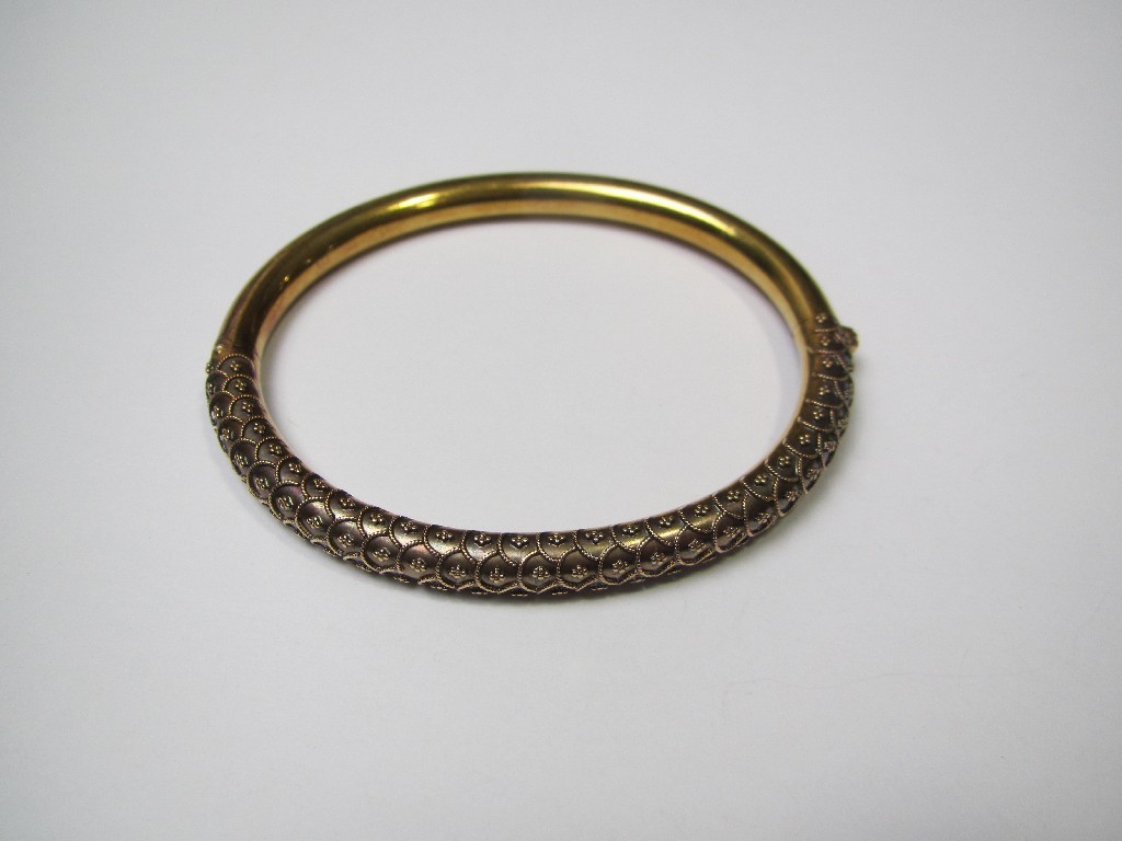 Appraisal: Victorian unmarked gold bangle with embossed bobble and rope twist