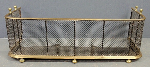 Appraisal: - Brass and wire fire fender c resting on ball