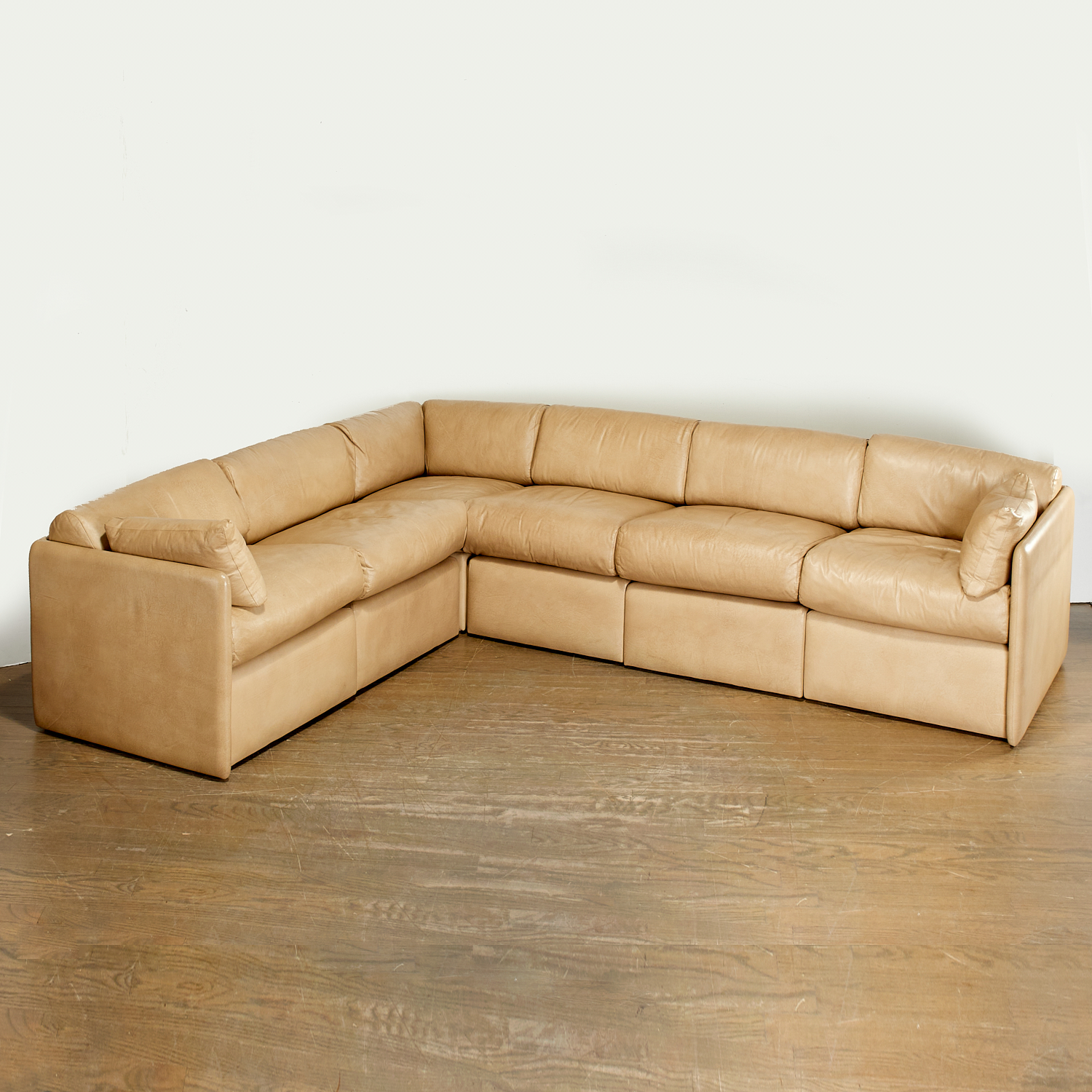 Appraisal: JOHN SALADINO LANDAU LEATHER SECTIONAL SOFA c American tan leather