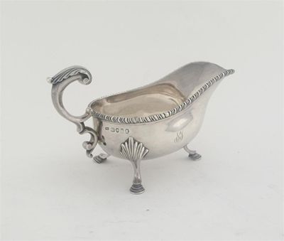 Appraisal: A George IV sauceboat with a gadrooned rim and a