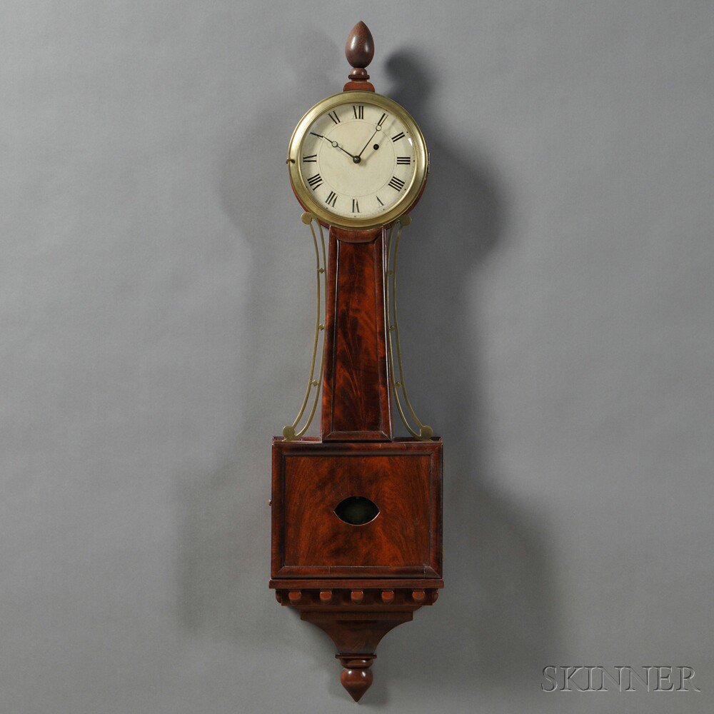 Appraisal: Mahogany Banjo Clock with half-round moldings enclosing the crotch mahogany