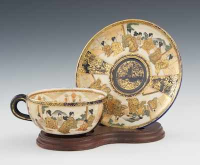 Appraisal: A Satsuma Geisha Samurai Cup and Saucer Meiji The western