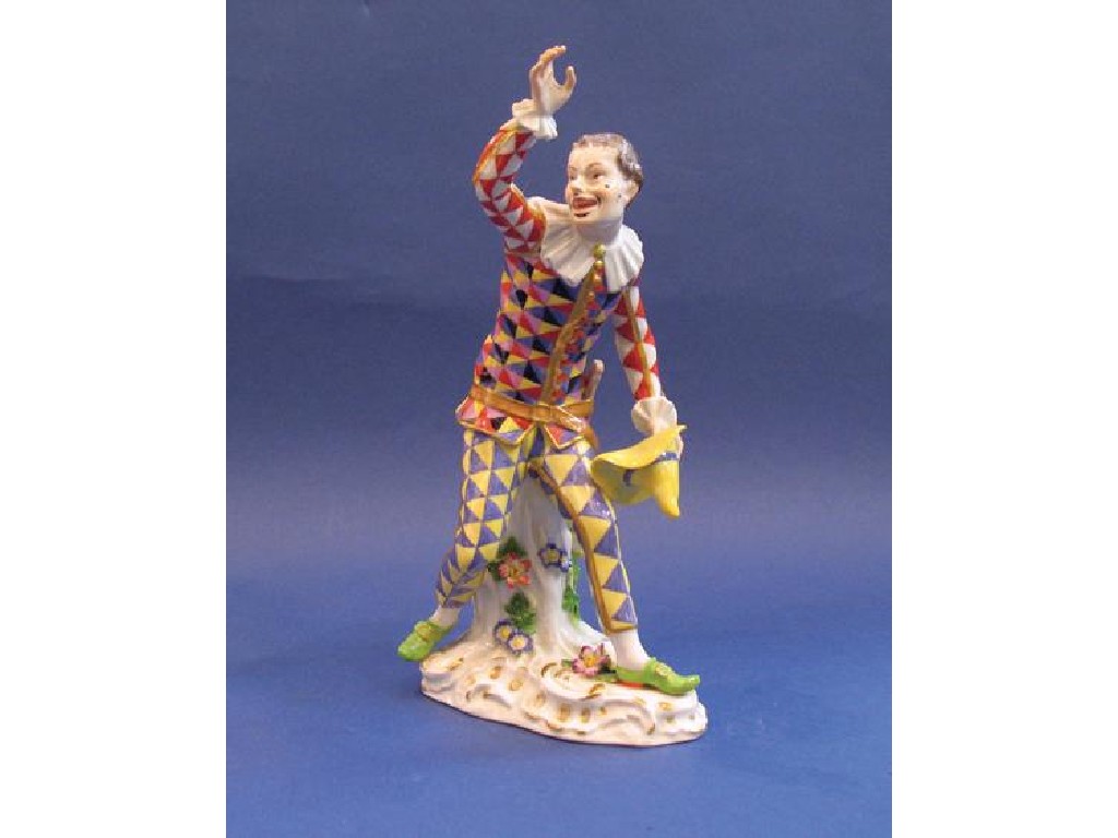 Appraisal: A MEISSEN FIGURE OF A HARLEQUIN with a yellow hat