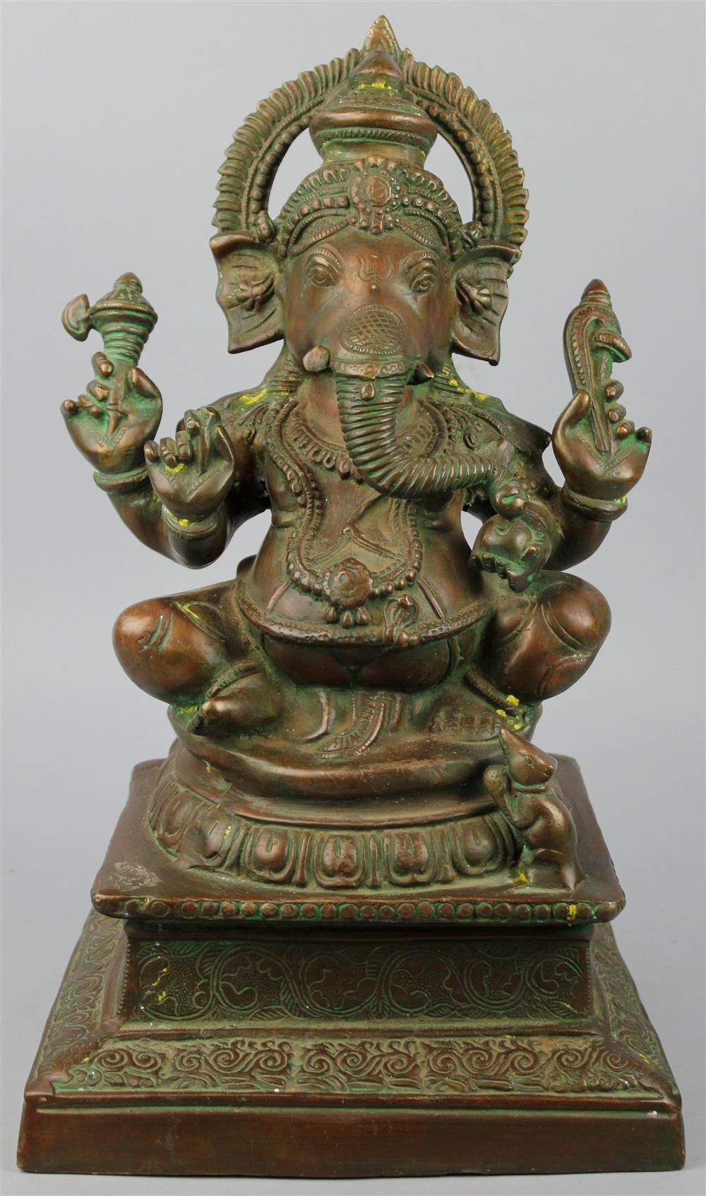 Appraisal: INDIAN BROWN-PATINATED BRASS FIGURE OF GANESHA the deity seated on