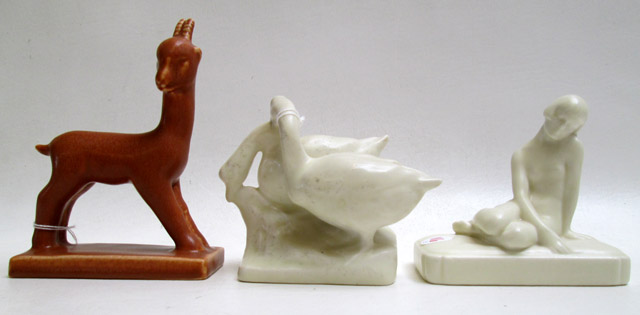 Appraisal: THREE ROOKWOOD ART POTTERY PAPERWEIGHTS Seated Nude ivory glaze impressed