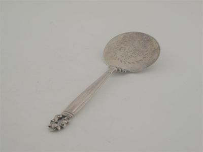 Appraisal: By Georg Jensen A serving slice with a circular blade