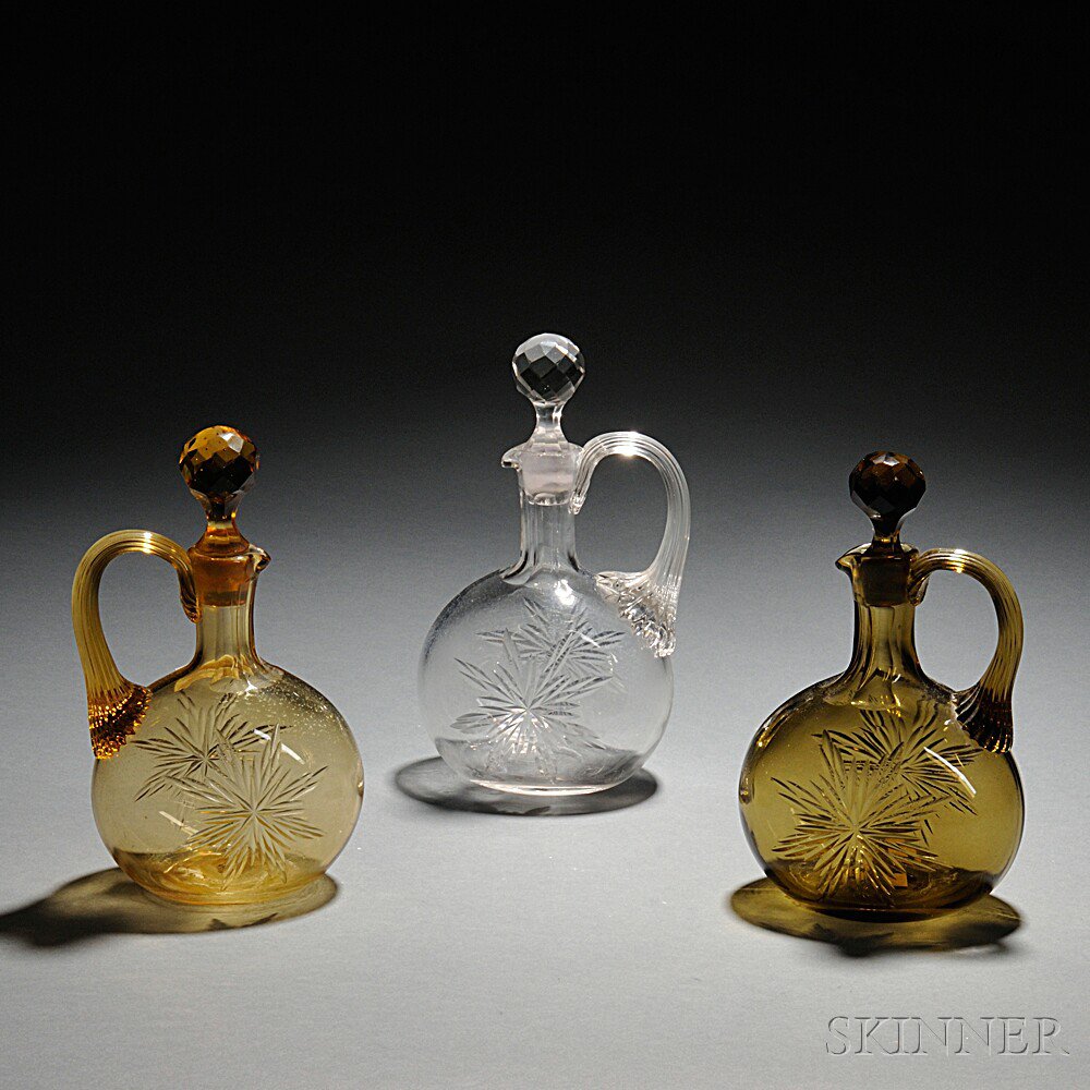 Appraisal: Three Sandwich-type Glass Whiskey Jugs each with a faceted stopper