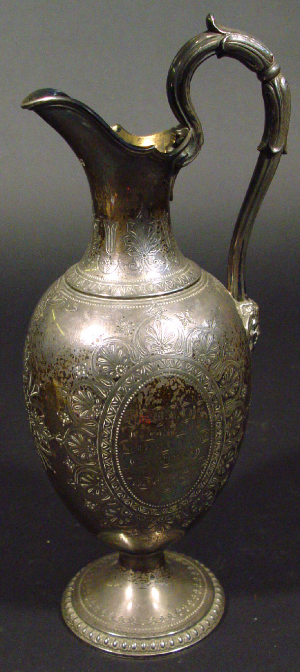 Appraisal: Victorian silver presentation claret jug with chased decoration and mask