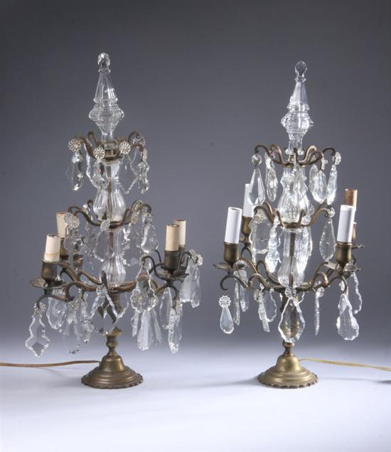 Appraisal: PAIR GILT-BRONZE AND CRYSTAL FOUR-LIGHT CANDELABRA early th century Suspending