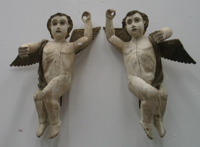 Appraisal: A pair of carved wooden winged Portugese Cathedral Angels painted