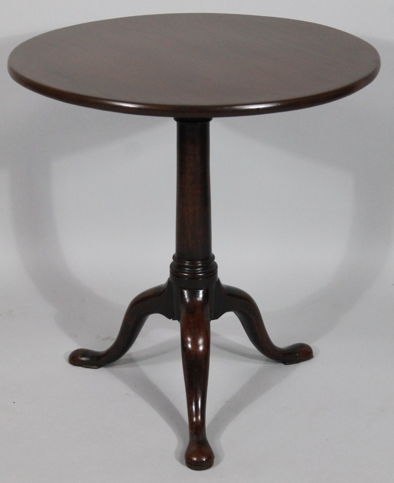 Appraisal: A Georgian mahogany tripod table the one piece circular top