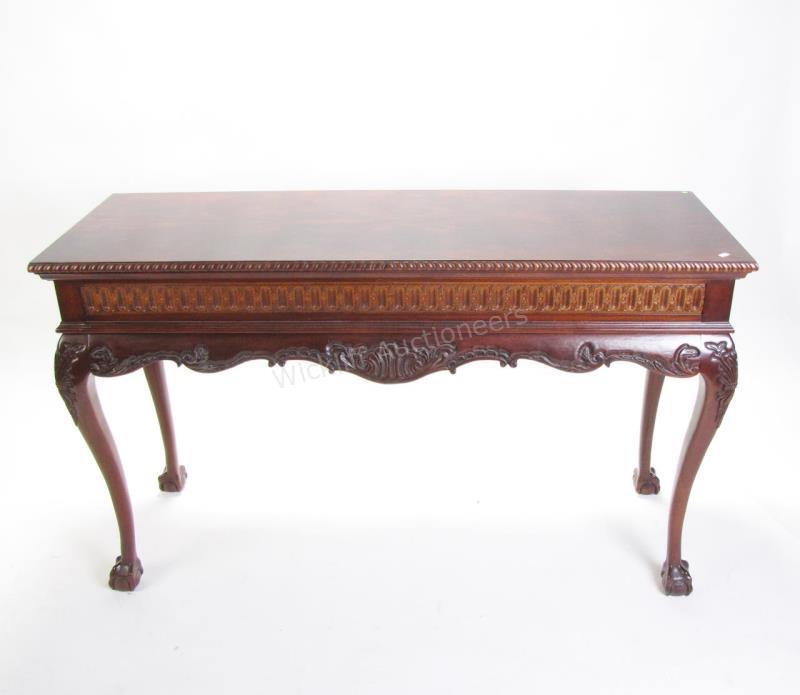 Appraisal: A mahogany console table floral carvings on apron and legs