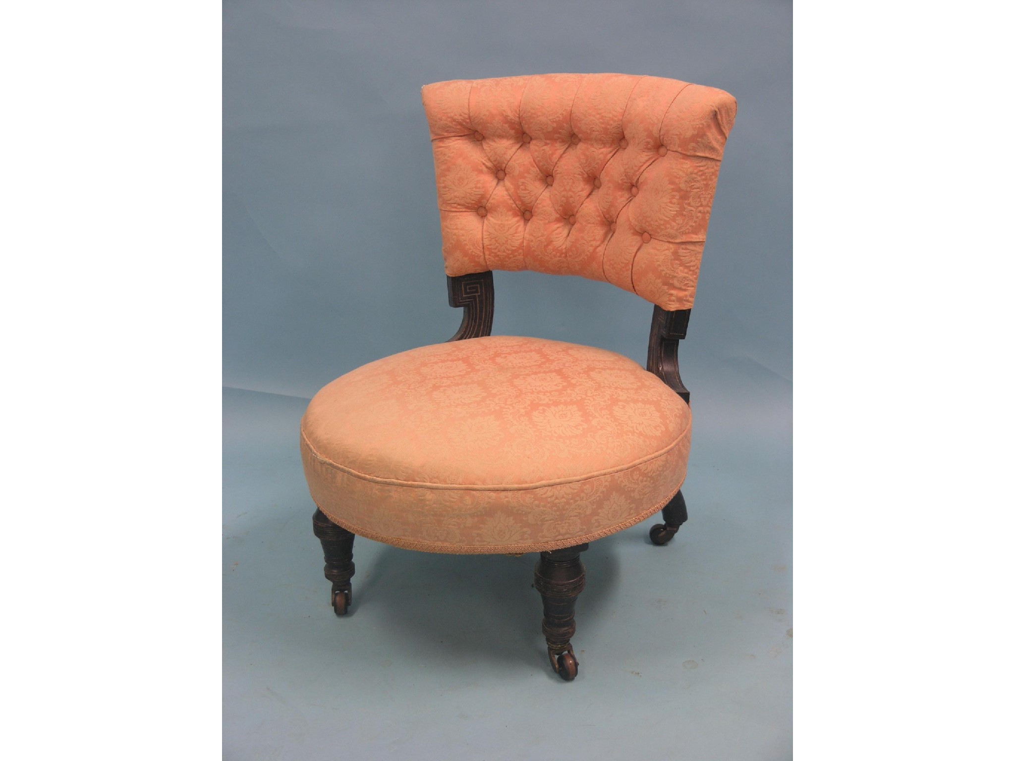 Appraisal: A Victorian upholstered nursing chair ebonised frame on turned legs