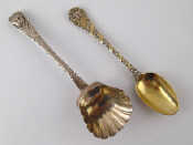 Appraisal: A Georgian silver sugar scoop with later embossed mask and