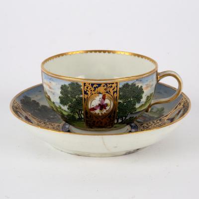 Appraisal: A Worcester teacup and saucer circa blue seal mark painted